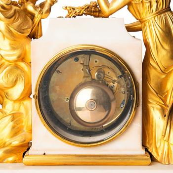A Louis XVI marble and ormolu mantel clock, late 18th century.
