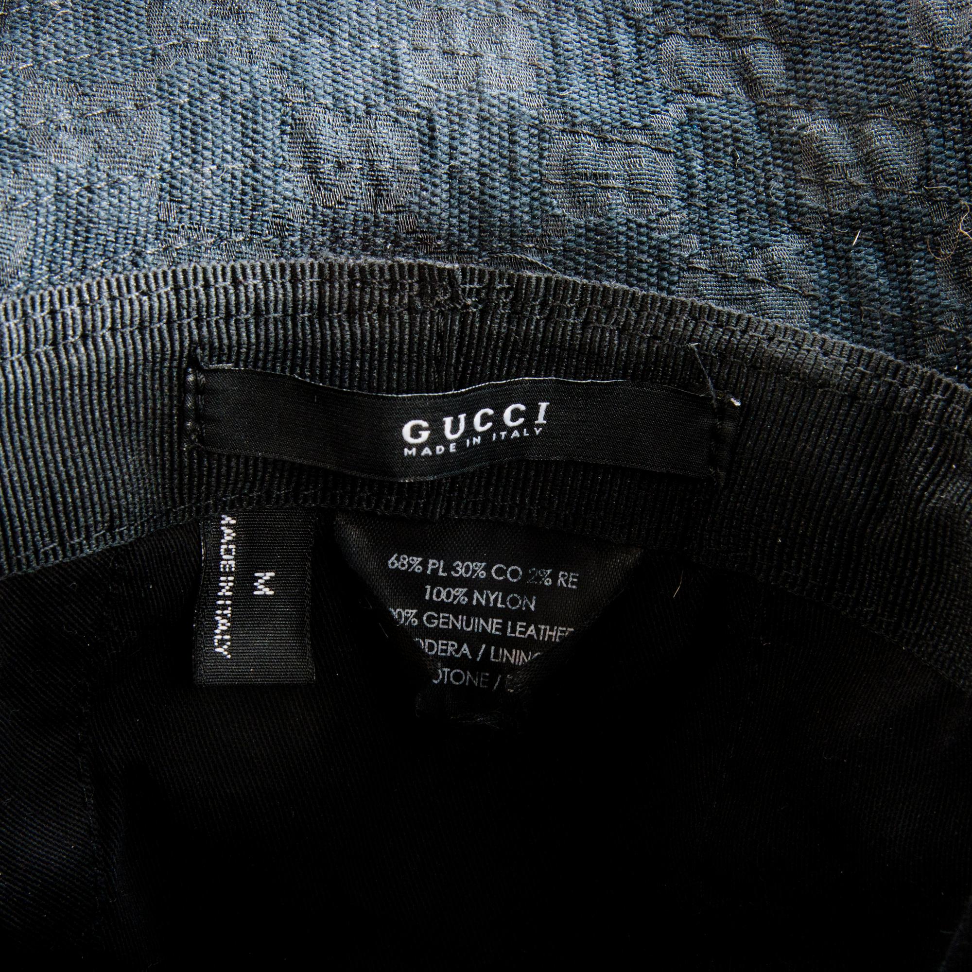 GUCCI, CAMEL HAIR PONCHO AND A HAT.