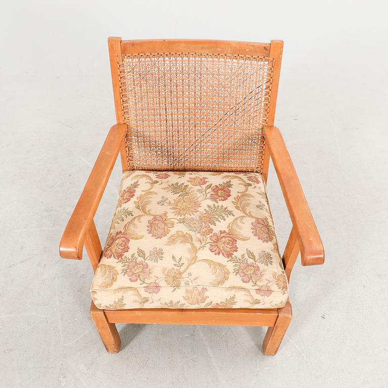 A 1940/50s rattan armchair.