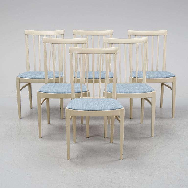 A dining table with six chairs by Carl Malmsten, second half of the 20th Century.