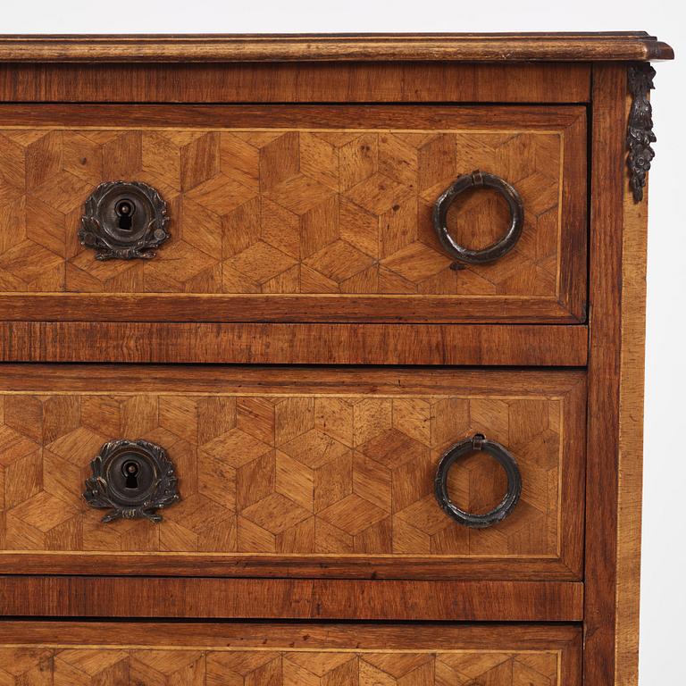 A Louis XVI-style parquetry commode, circa 1900.