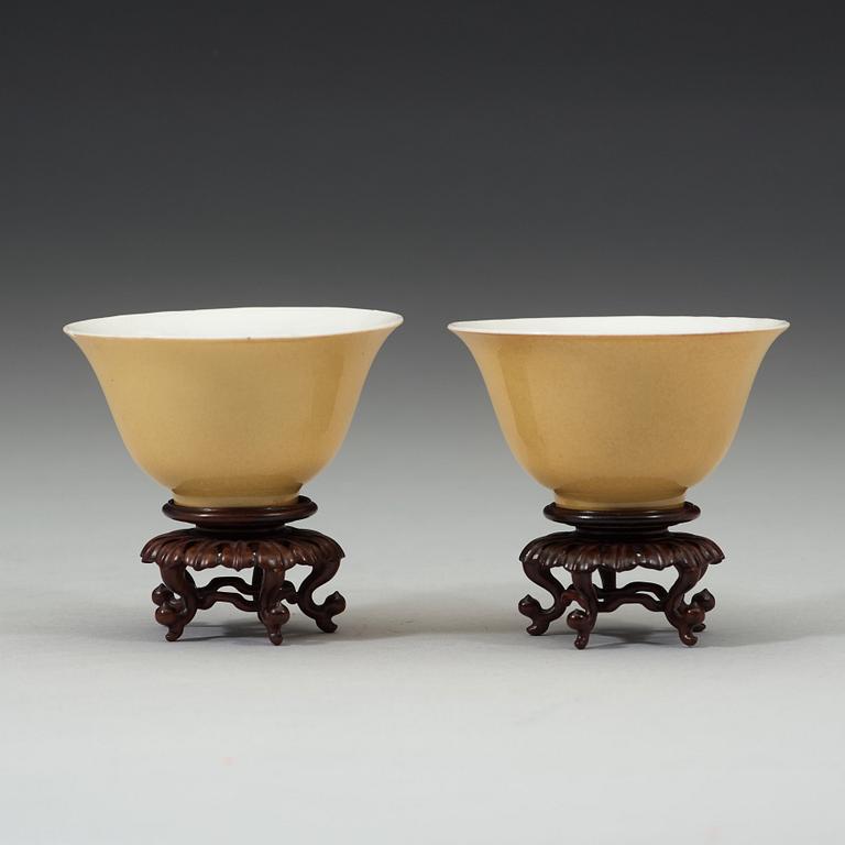 A pair of Imperial yellow bowls, Qing dynasty, Yongzheng six-character mark and of the period (1723-1735).