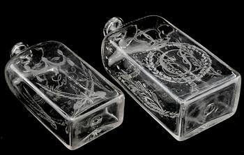 BRÄNNVINSFLASKOR, 2 st, glas, daterade 1833 respektive 1843.