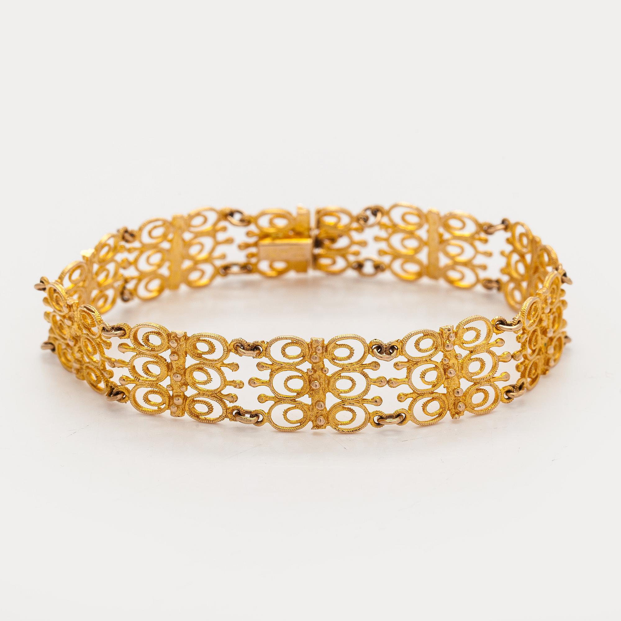 Esko Raitanen, collier, armband och örhängen, 14K guld, Helsingfors 1972.
