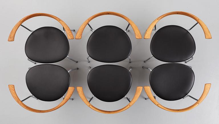 Hans J. Wegner, a set of six "JH-701" oak and black leather chairs by Johannes Hansen, Denmark.