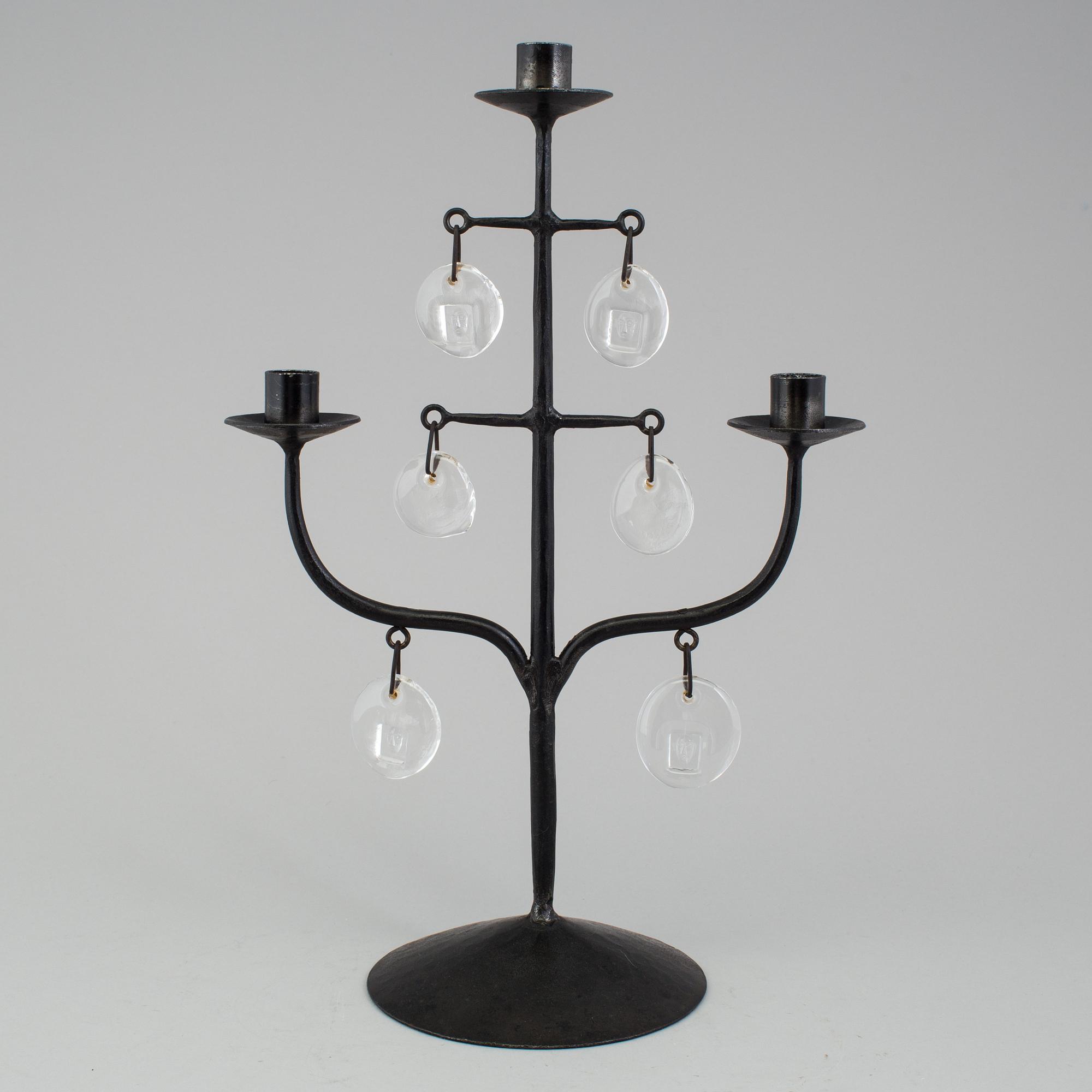 A wrought iron and glass candelabra by Erik Höglund.