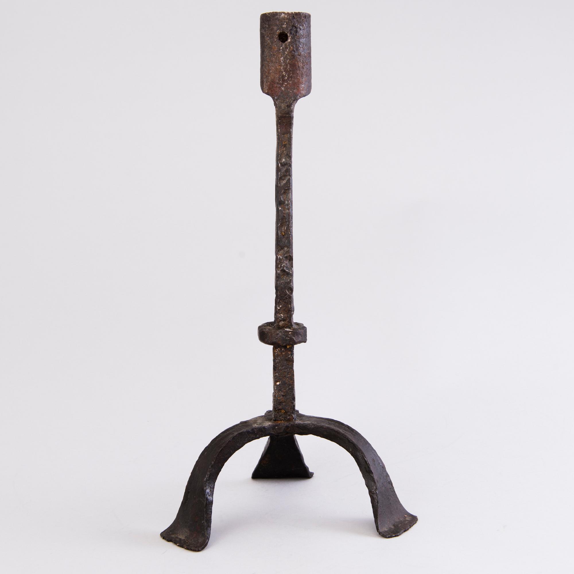 A CANDLESTICK, iron, 18th century or older.