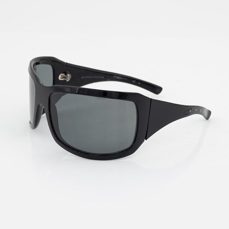 Bottega Veneta, a pair of sunglasses.