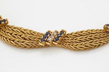 An 18K gold necklace set with eight-cut diamonds and sapphires.