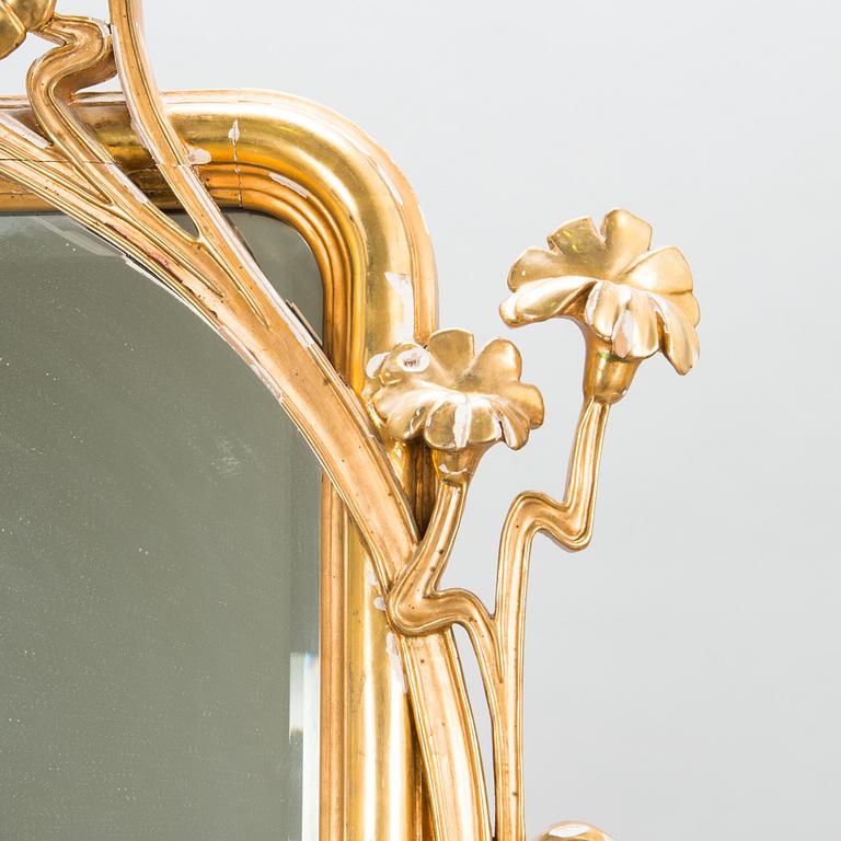 An Art Nouveau mirror with console table from early 20th century.
