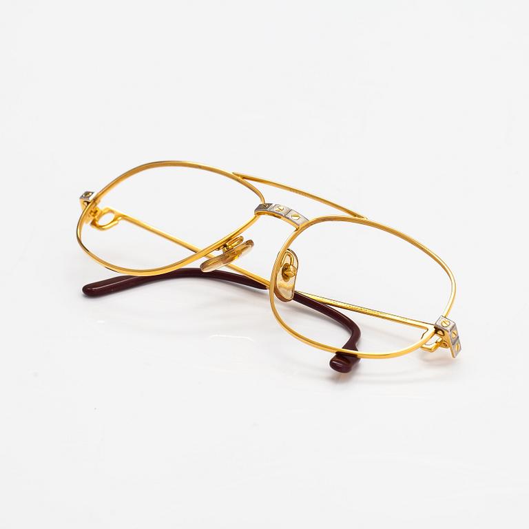 must de Cartier, Santos, a pair of eyeglass frames. Marked Cartier, Paris, Made in France 135, 56, 16.