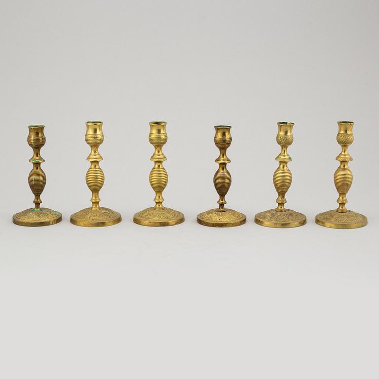 A set of 6 brass candlesticks, (3 pairs), 19th century.