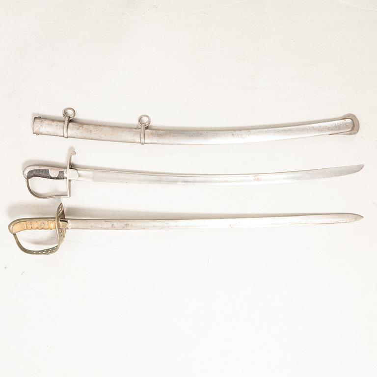 Swords 2 pcs, Swedish, m/1867 for the cavalry, and m/1831 for artillery personnel, with scabbard.