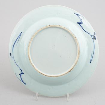 A group of four blue and white dishes and a cabaret piece, Qing dynasty, 18th century.