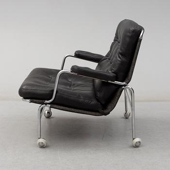 BRUNO MATHSSON, a "Karin" black leather easy chair.