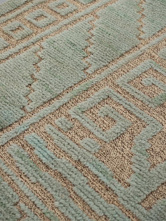 Märta Måås-Fjetterström, A carpet, "Vita spetsporten, grönblå", knotted pile in relief, ca 310,5-314 x 252 cm, signed MMF.