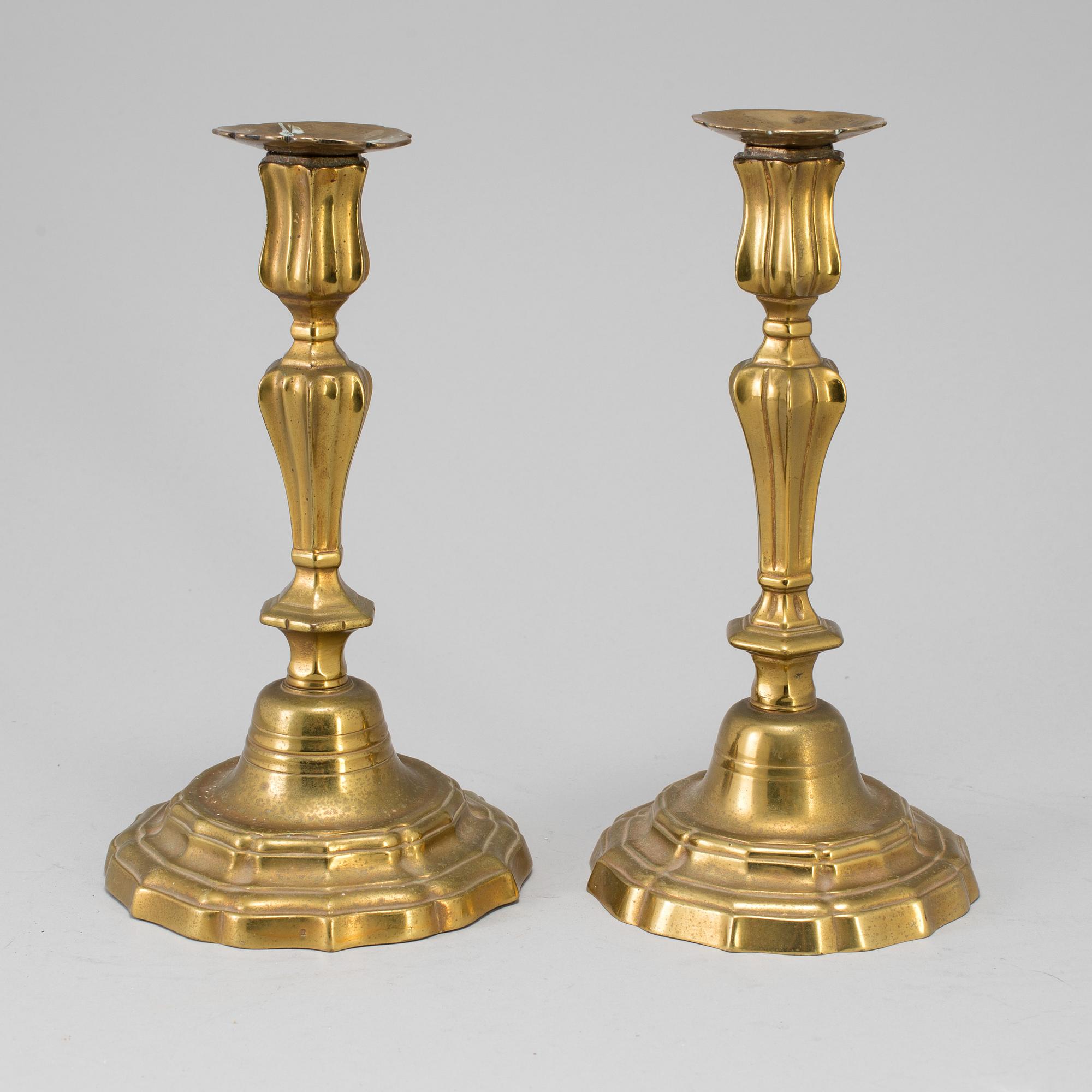 A pair of 18th century bronze candlesticks.