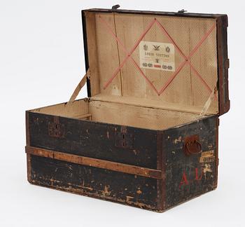 610. A late 19th century black trunk by Louis Vuitton.