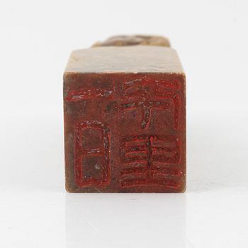 A set of four stone scholars objects and a enameled silver box with cover, Qing dynasty, circa 1900.