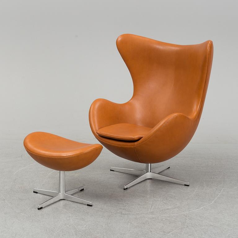 ARNE JACOBSEN, an 'Egg' anilin leather lounge chair and ottoman Fritz Hansen, Denmark, 2019.