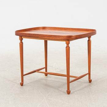 A model 974 mahogany side table by josef Frank for Firma Svenskt Tenn, post 1985,  designed in 1938.