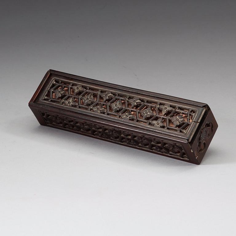 A black lacquer and gold fan in a silk clad box, Qing dynasty, 19th Century.