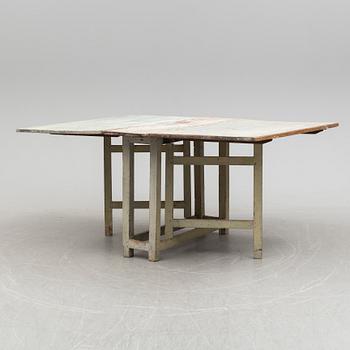 a gate-legged table from the first half of the 19th century.