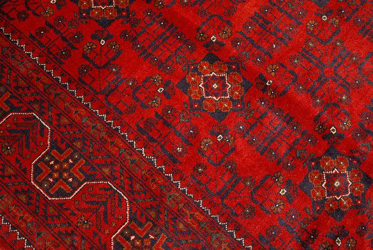 An Afghan rug, c. 298 x 251 cm.