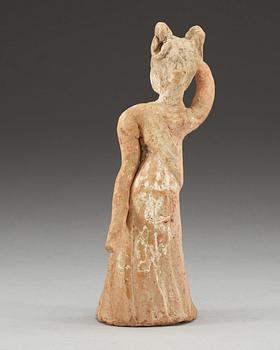 A potted figure of a dancer, Tang dynasty (618-907).