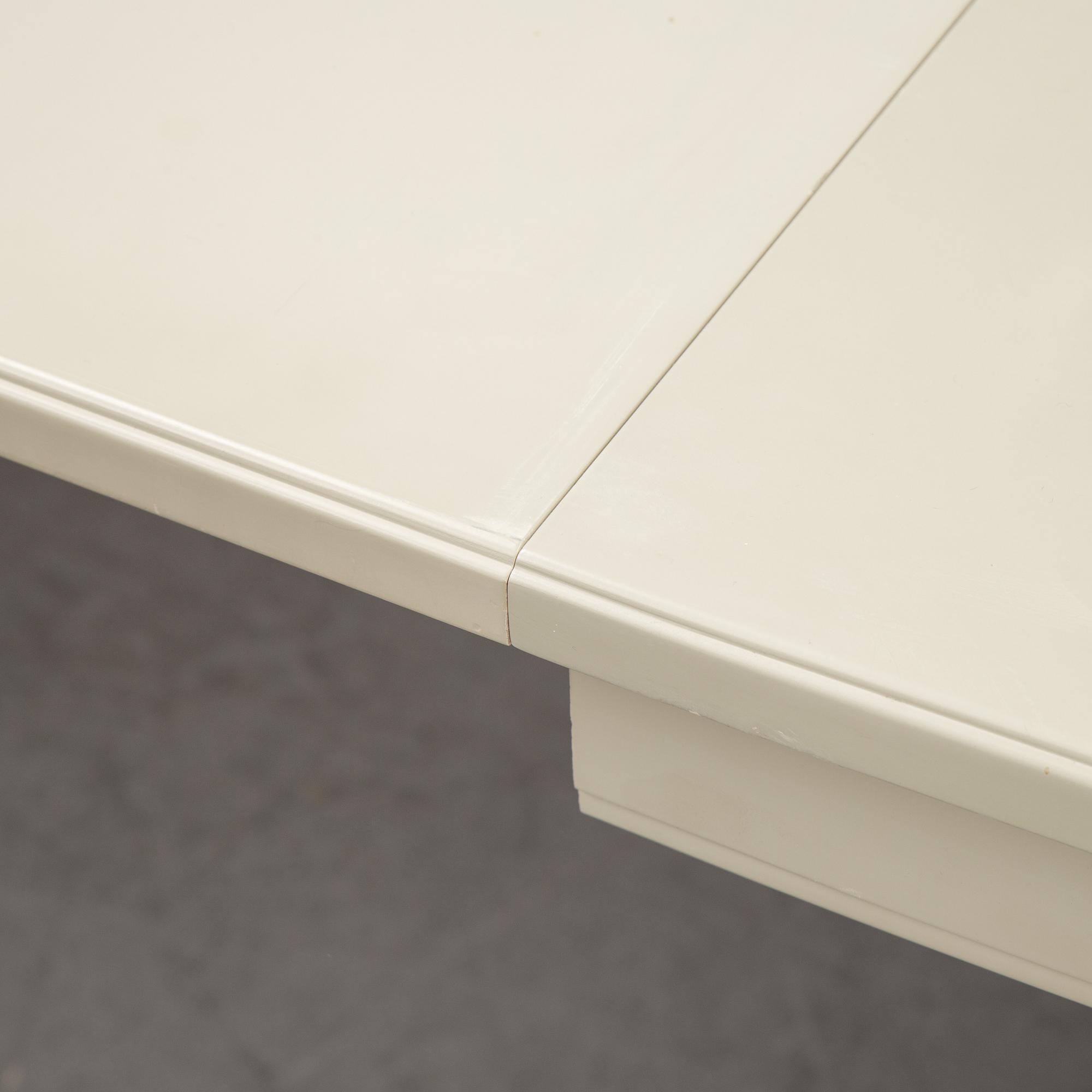 A dining table with two armchairs and six chairs by Carl Malmsten for Bodafors.