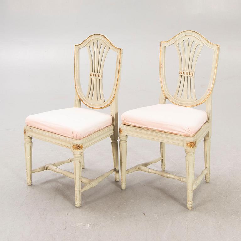 A öpair of painted Gustavian chairs.