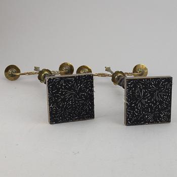 A pair of brass Empire style candle holders, 20th century.