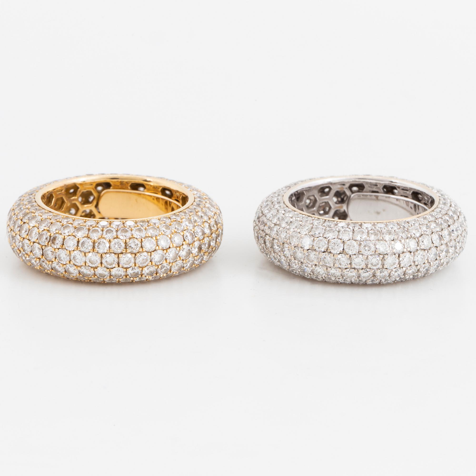Two brilliant-cut diamond rings.