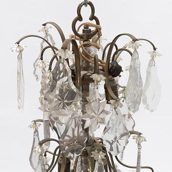 A six-light rococo-style chandelier, later part of the 20th century.