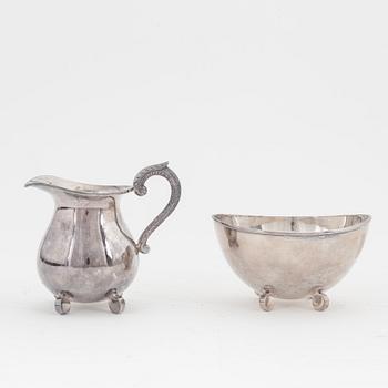 A sterling silver coffee pot, teapot, creamer and sugar bowl.