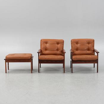 Illum Wikkelsö, a pair of 'Capella' armchairs and an ottoman, second half of the 20th century.