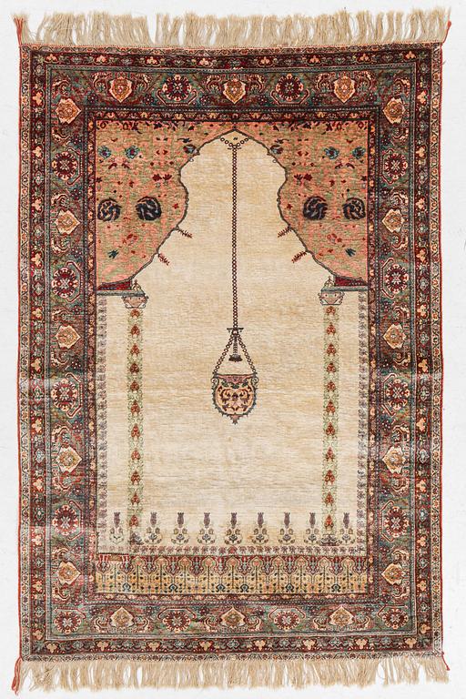 A semi-antique silk rug, probably Tabriz, c 164 x 110 cm,.