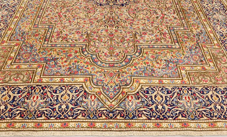 A Kirman Laver carpet, 'Millefleur', approx. 410 x 296 cm.