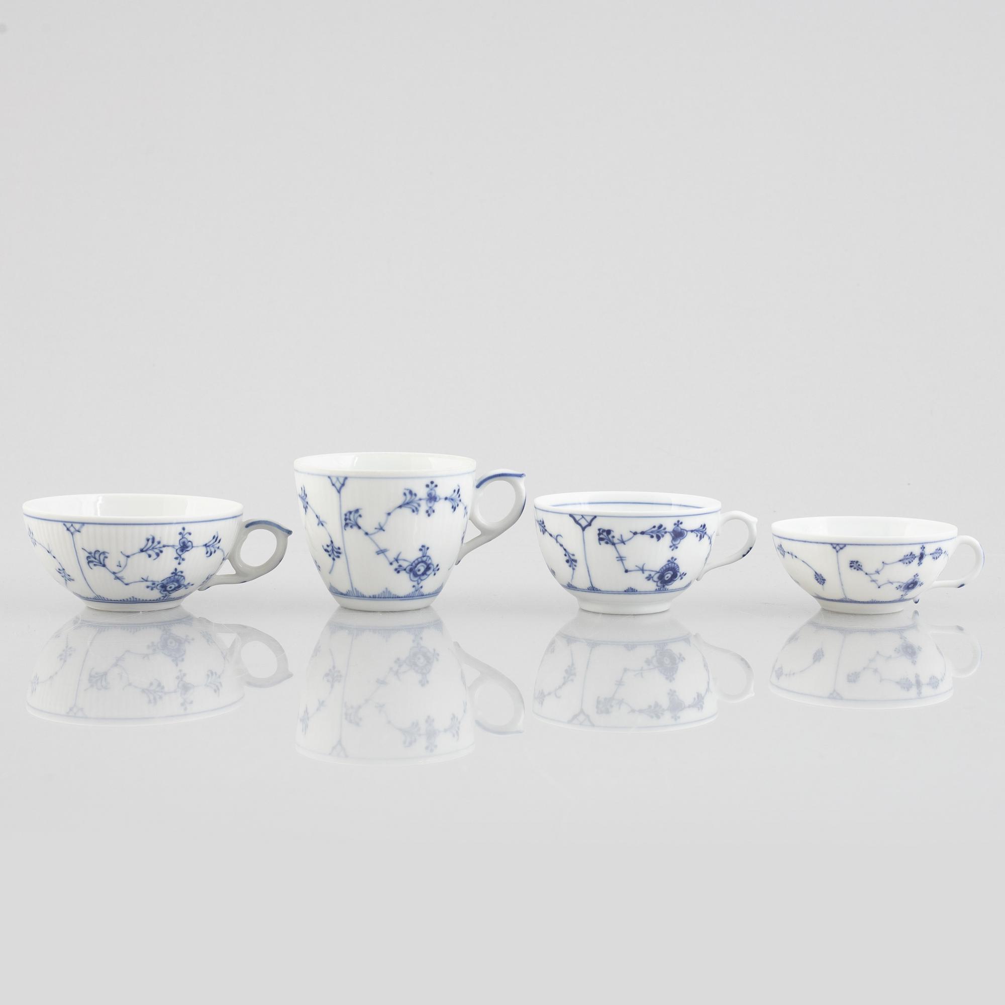 A group of four 'Blue Fluted' / 'Musselmalet rifflet' cups with saucers, Royal Copenhagen, 19th century and later.