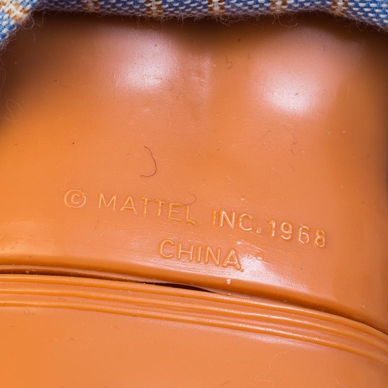 A plastic doll's house with six dolls, furniture and clothes, 20th century.