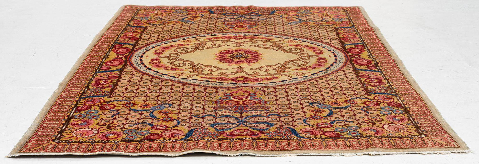 A semi-antique Tabriz carpet of Aubusson design. 246 x 171 cm.