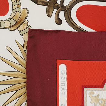 Hermès, a 'Les Eperons' silk scarf.
