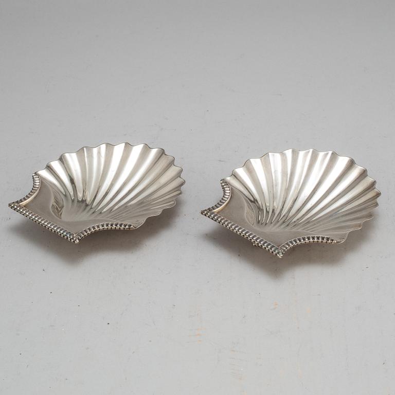 An English early 19th century pair of silver butter-shells, mark of London 1807.