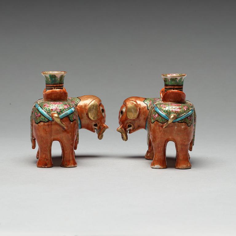 A pair of Canton candle sticks in the shape of elephants, Qing dynasty, 19th century.