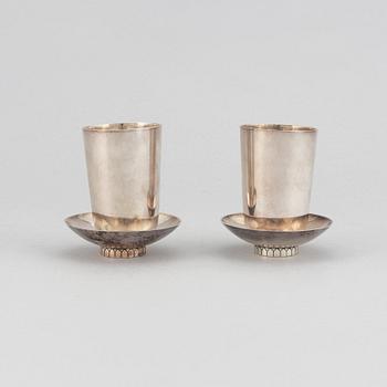 Sigvard Bernadotte, two beakers and two ashtrays, Copenhagen 1945-77, sterling silver, design nr 825A and 825.