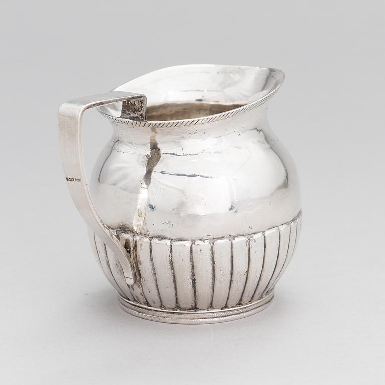 A silver, cream jug, Cyrillic maker's mark Sinkoni, Finland 1824.
