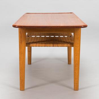 An oak and tek coffee table by Hans J Wegner for Andreas Tuck, 1960s.