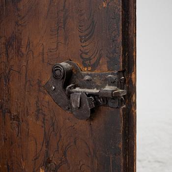A corner cabinet, 18th Century.