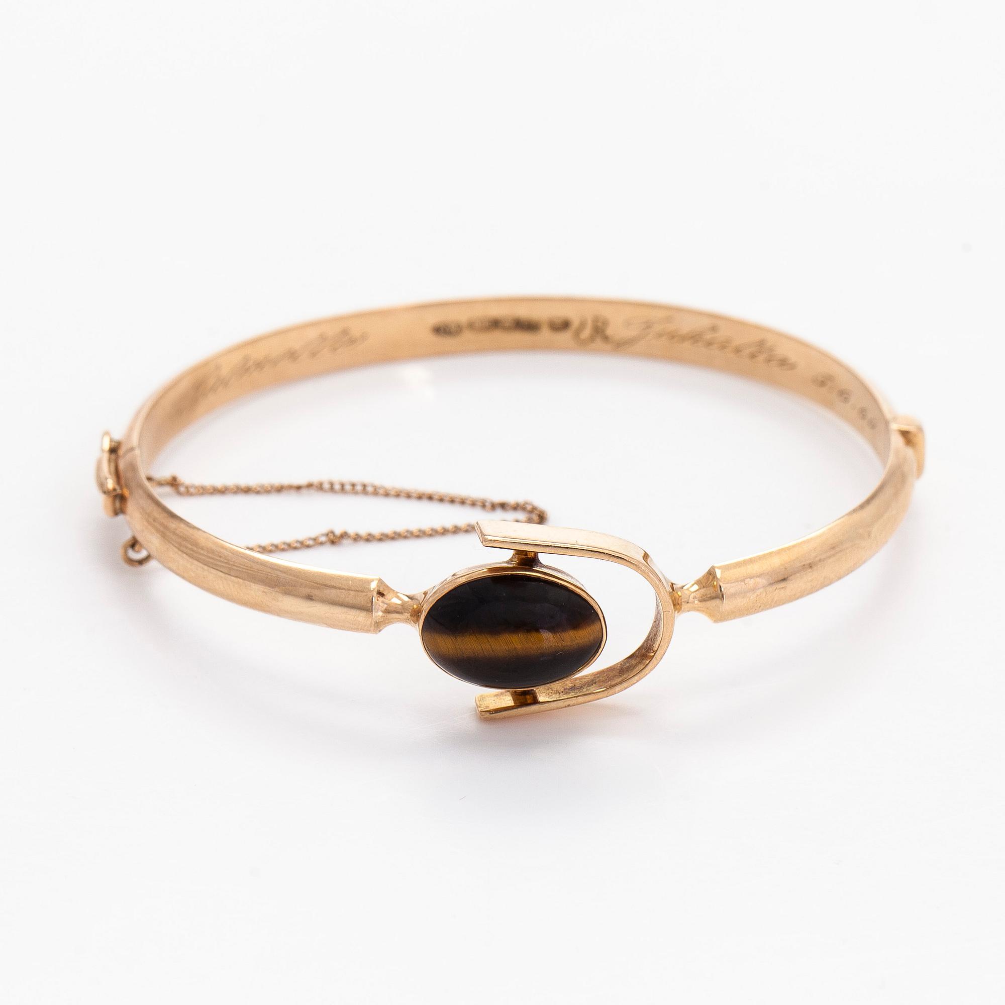 Eero Rislakki, armband, 14K guld och tigeröga, Westerback Helsingfors 1957.