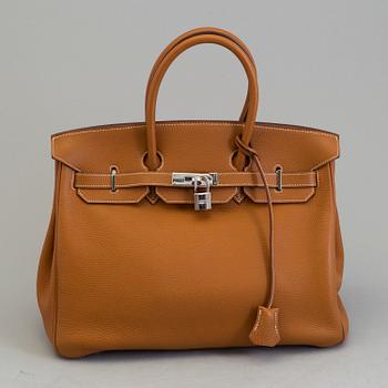 A gold togo Birkin 35 handbag by Hermès from 2004.